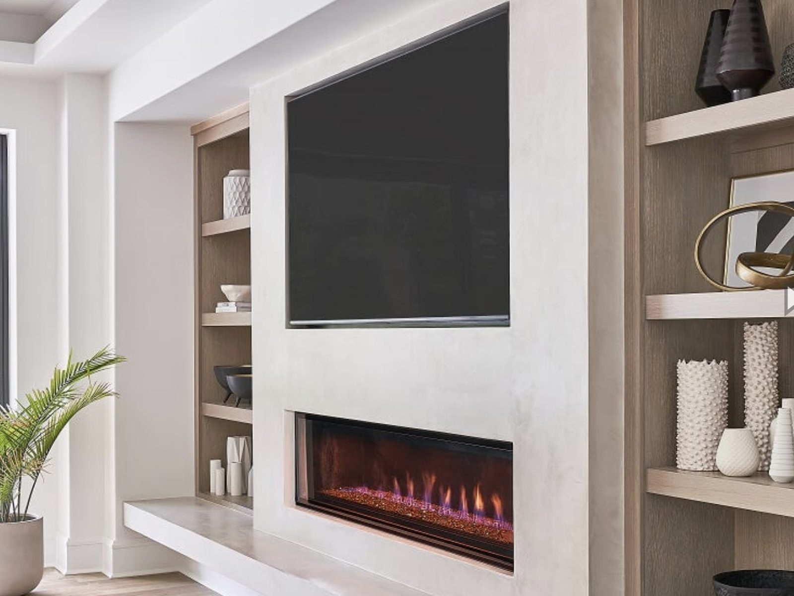 Linear fireplace with plaster surround and oak built-in shelving