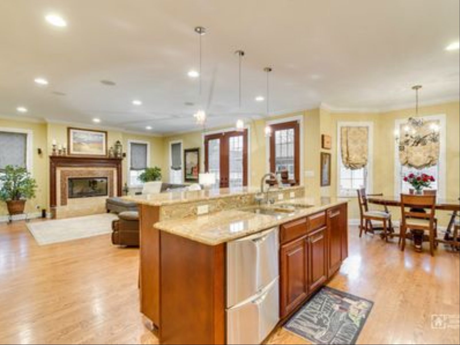 Open kitchen with granite island looking through to the family room