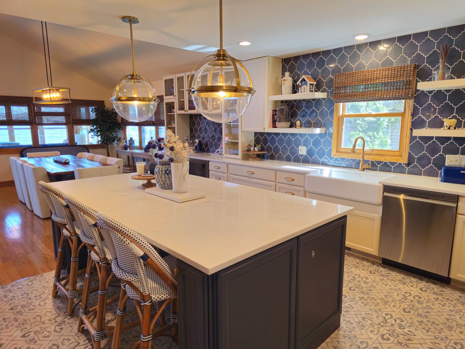 Kitchen island and patterned tile floor looking toward the dining table