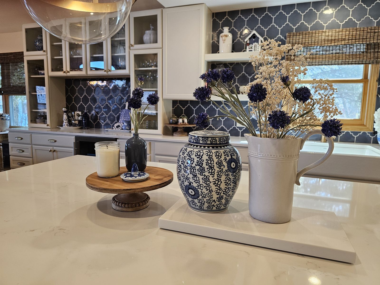 Blue and white ginger jar and dried florals styled on the island